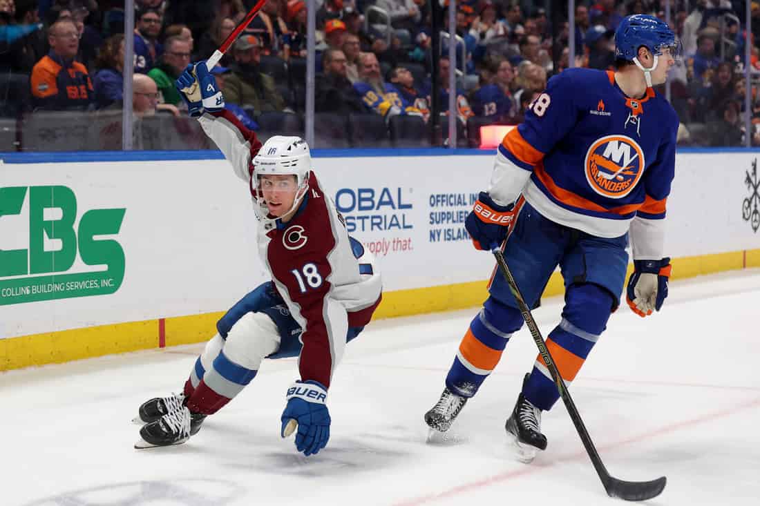 Colorado avalanche player being dribbled